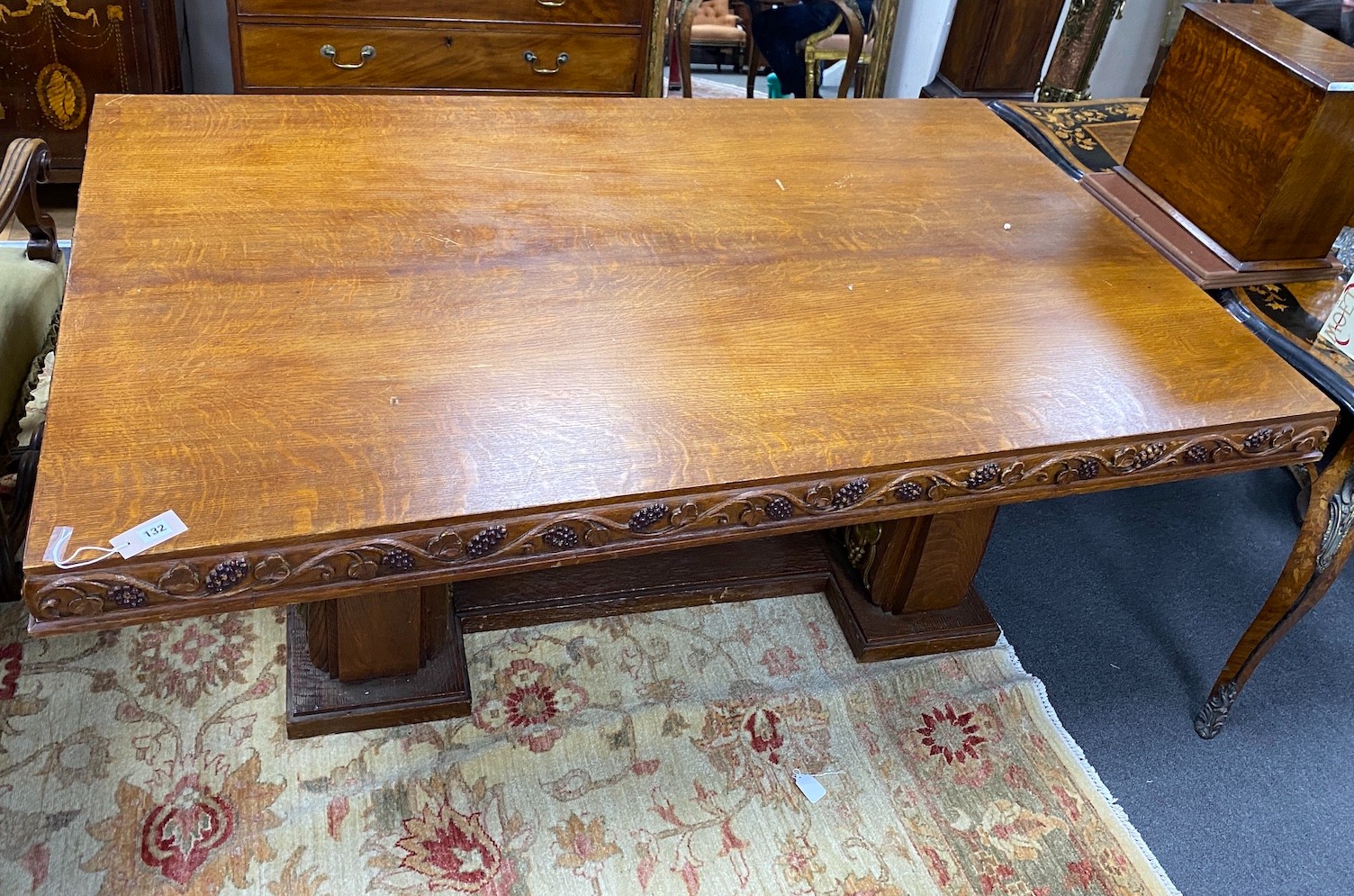 An early 20th century gilt bronze mounted rectangular oak dining table with carved fruiting vine decoration, width 180cm, depth 113cm, height 75cm